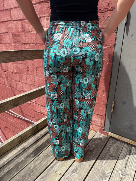 Tattoos In Turquoise Pants