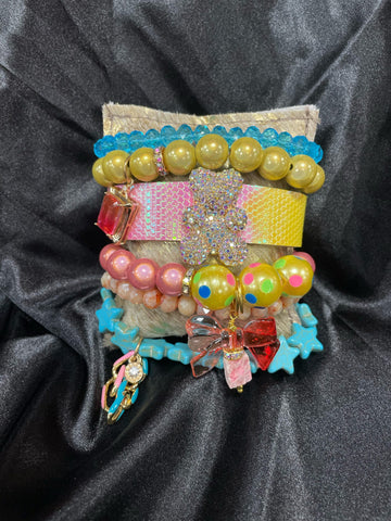 Bear Cuff, Charms & Multicolor Bracelets on HOH Pillow